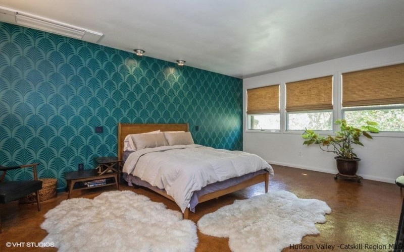 Master bedroom with handprinted wall pattern and cork floors