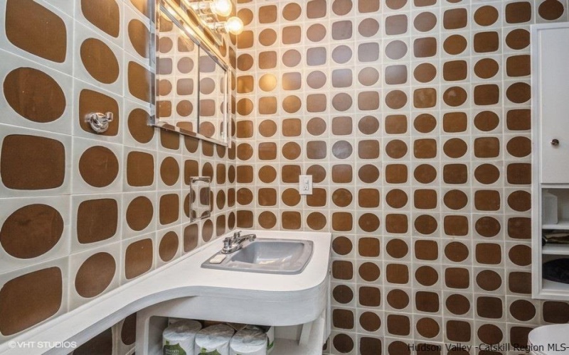 Lower level bathroom with original Ginori Italian custom tiles from the 1960s.